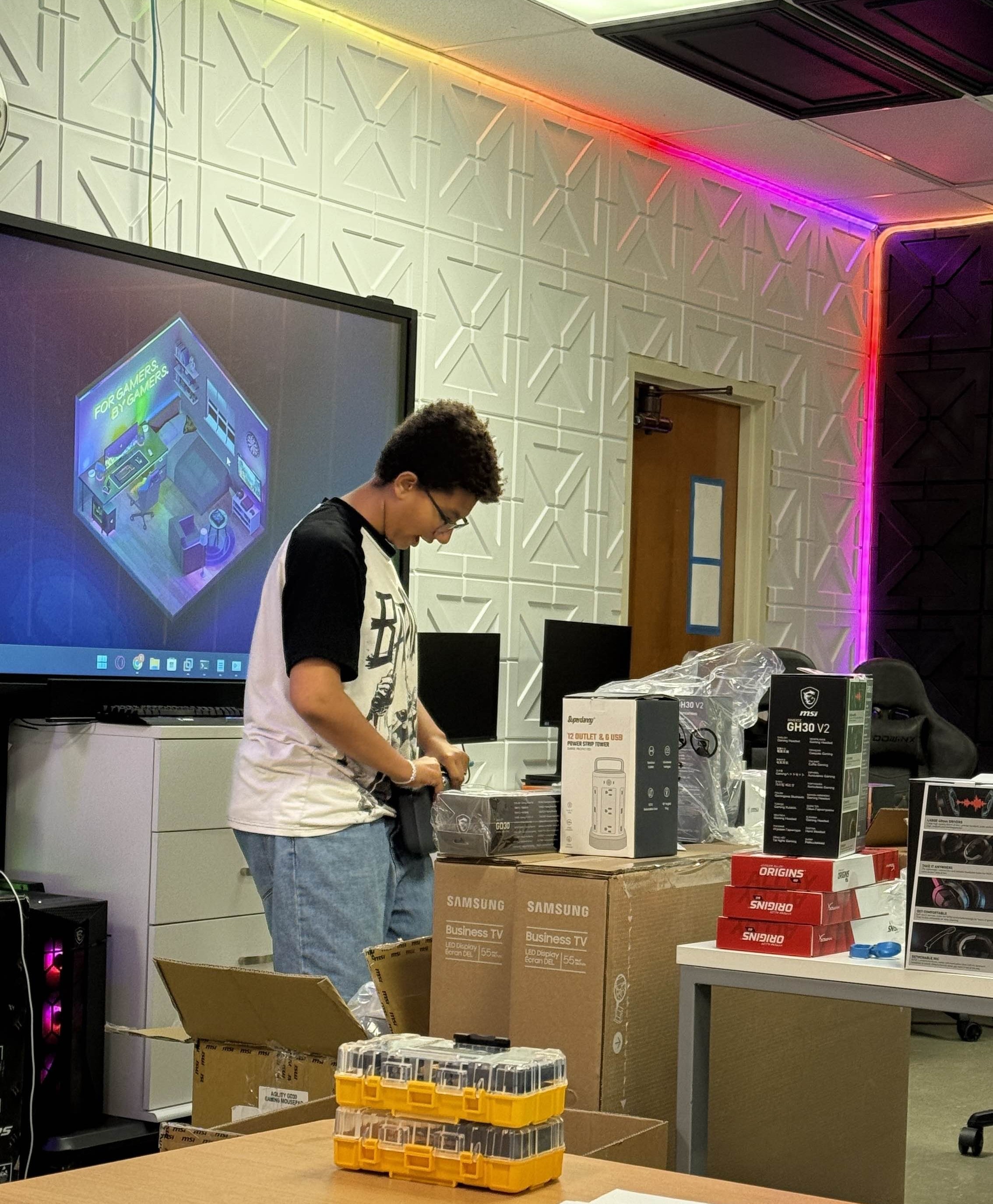 Student unboxing new equipment in the lab
