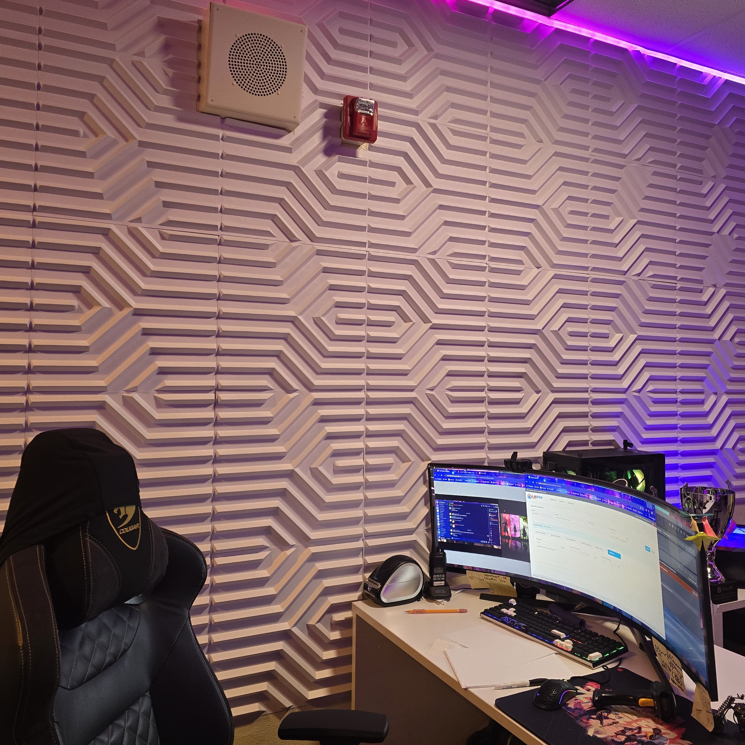 3D honeycomb wall design with purple LED accent